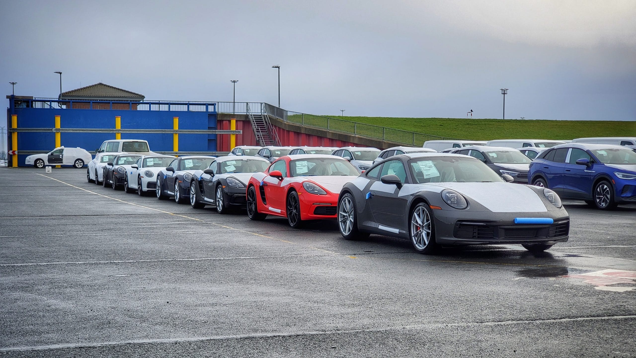 Multiple Cars parked in line at harbour